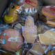 Thai pro-democracy protesters sell cookies featuring a three-finger salute on December 10, 2020 in Bangkok, Thailand.
